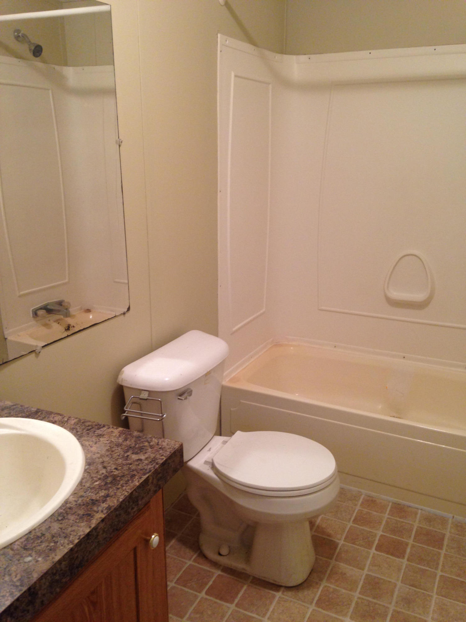 873 Lighthouse Church Road Holt, FL 32564 - Photo 11 of 18 a bathroom with a granite countertop toilet a sink and a shower