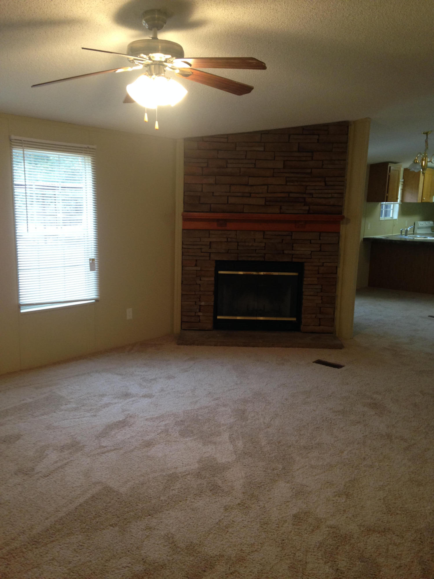 873 Lighthouse Church Road Holt, FL 32564 - Photo 6 of 18 a view of empty room with a fireplace