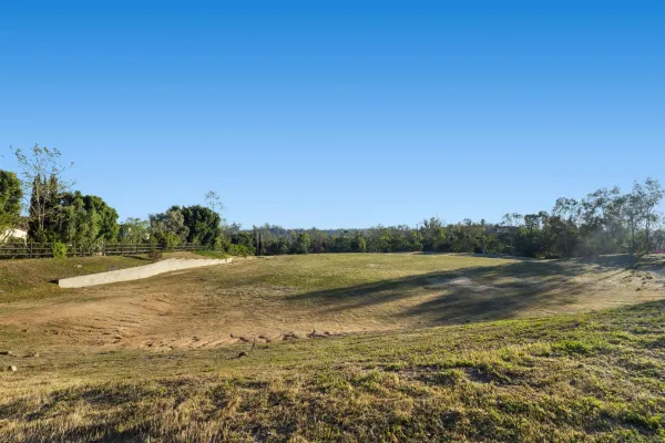 a view of a lake with a big yard