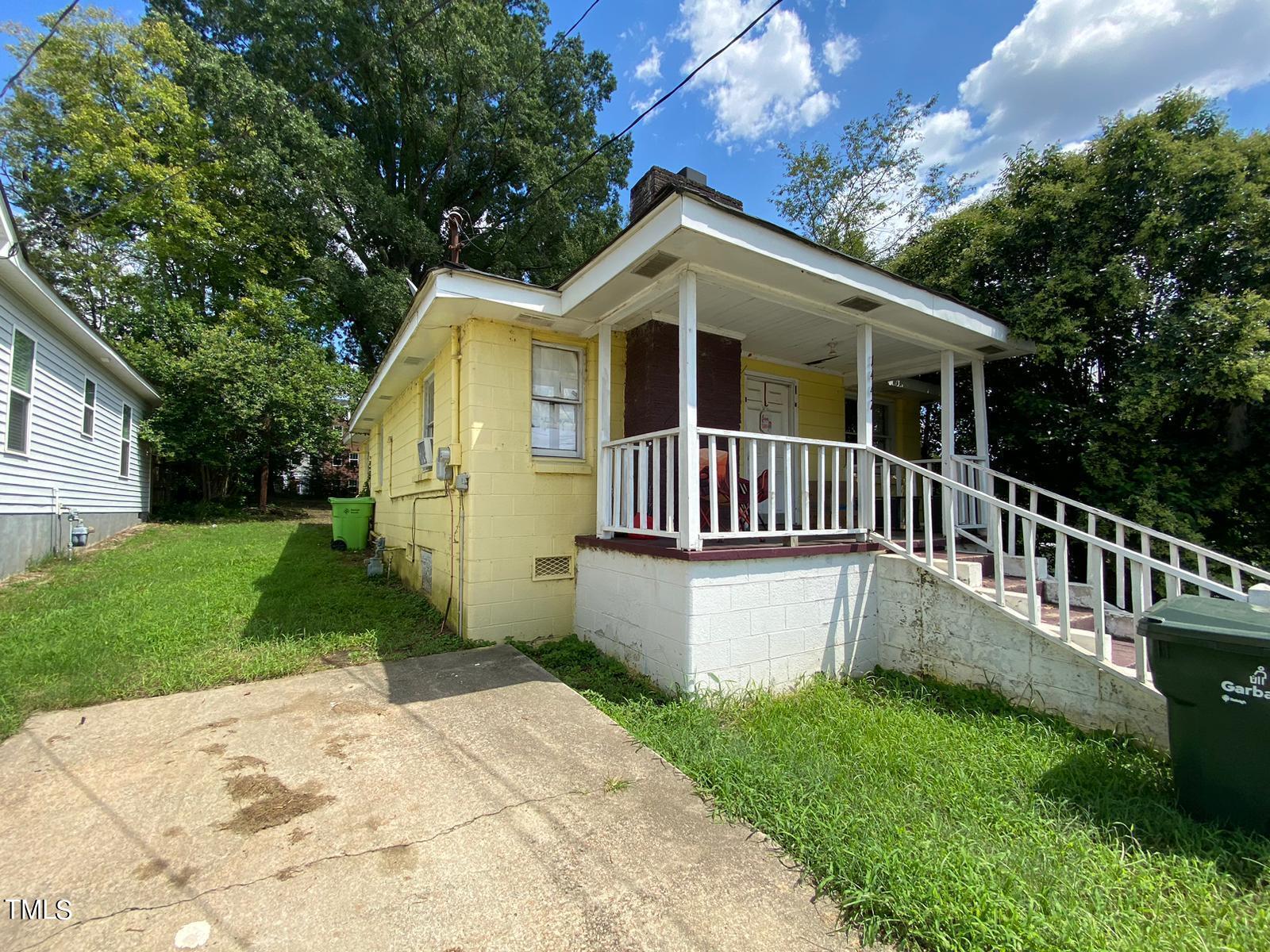 1447 Garner Road Raleigh, NC 27610 - Photo 2 of 10 a view of a house with a yard and deck