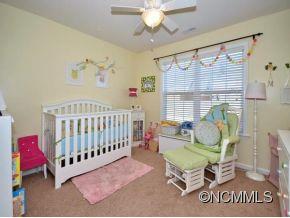 306 Lumber River Road Fletcher, NC 28732 - Photo 11 of 15 a bedroom with furniture and a window