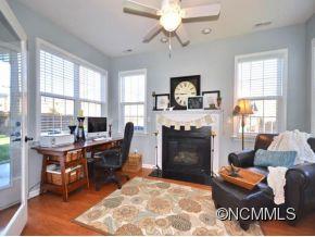 306 Lumber River Road Fletcher, NC 28732 - Photo 6 of 15 a living room with furniture a fireplace and a table