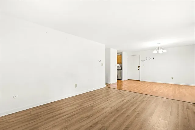 an empty room with wooden floor