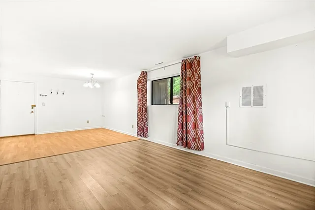 a view of a livingroom with wooden floor