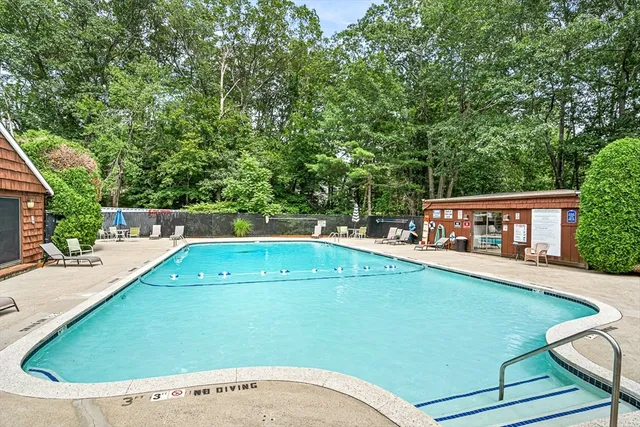 a view of a swimming pool with a patio