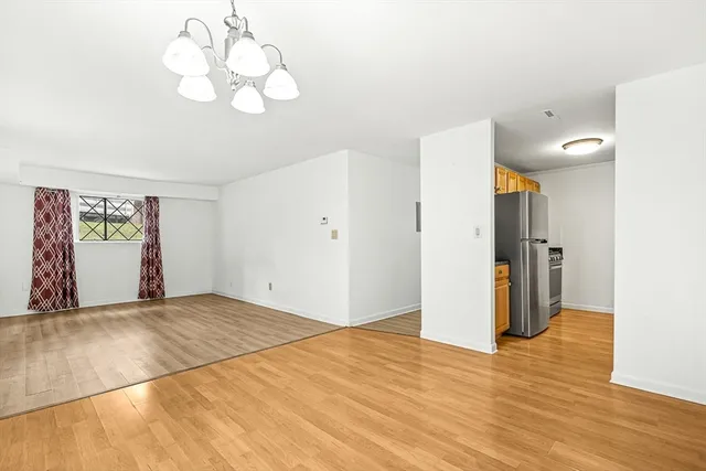 a view of a livingroom with wooden floor