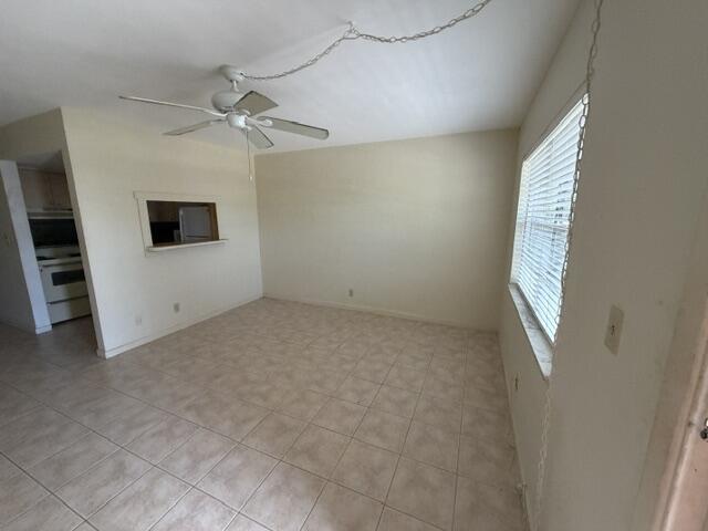 660 Glouchester Street, Unit 206 Boca Raton, FL 33487 - Photo 3 of 13 wooden floor in an empty room with a window