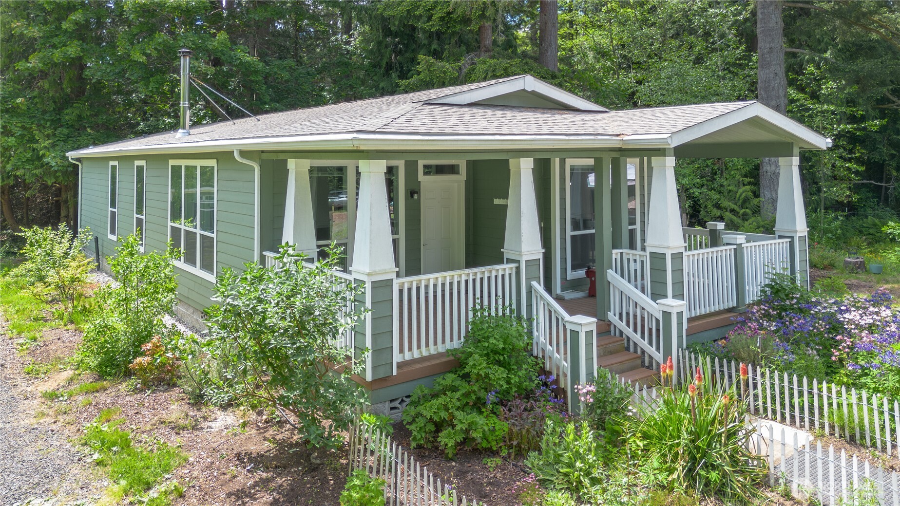 290 Werner Road Port Ludlow, WA 98365 - Photo 7 of 40 a view of a house with garden and porch
