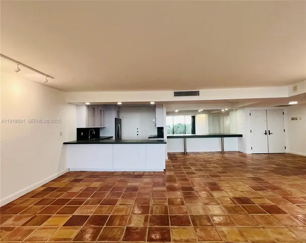 a view of a kitchen with a sink