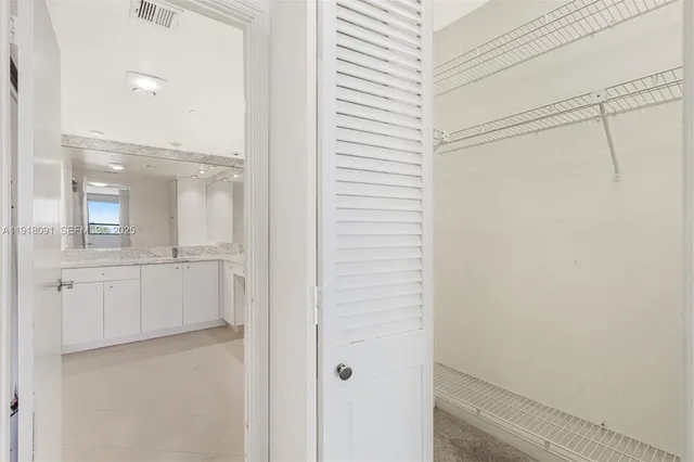 a bathroom with a shower and mirror