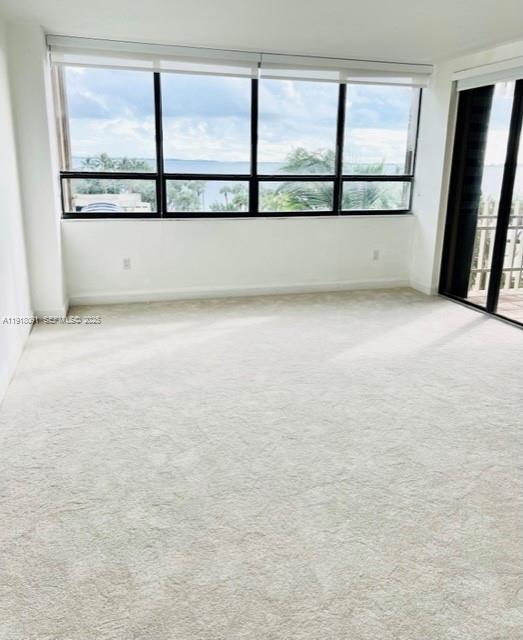 1 Grove Isle Drive, Unit A405 Miami, FL 33133 - Photo 10 of 21 a view of an empty room with a window