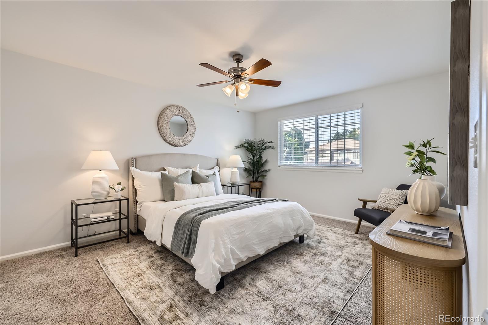 1552 Spring Water Place Highlands Ranch, CO 80129 - Photo 11 of 28 a bedroom with a bed and a chandelier