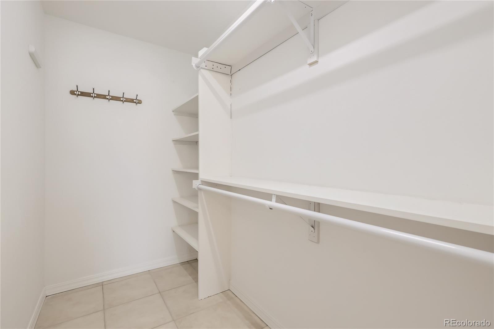 1552 Spring Water Place Highlands Ranch, CO 80129 - Photo 15 of 28 a view of an empty walk in closet