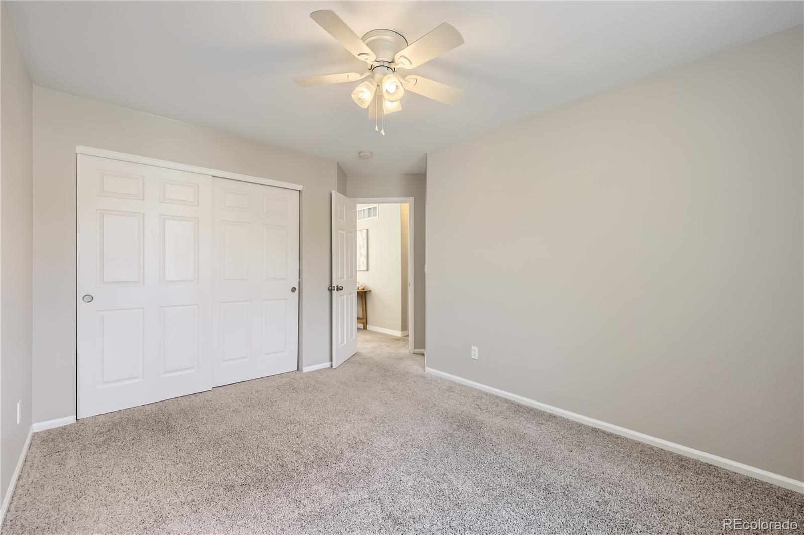 1552 Spring Water Place Highlands Ranch, CO 80129 - Photo 17 of 28 a view of a big room with a chandelier fan