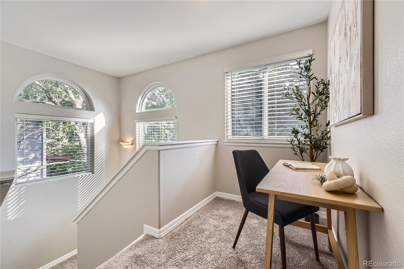 1552 Spring Water Place Highlands Ranch, CO 80129 - Photo 21 of 28 a view of a dining room with furniture window and outside view