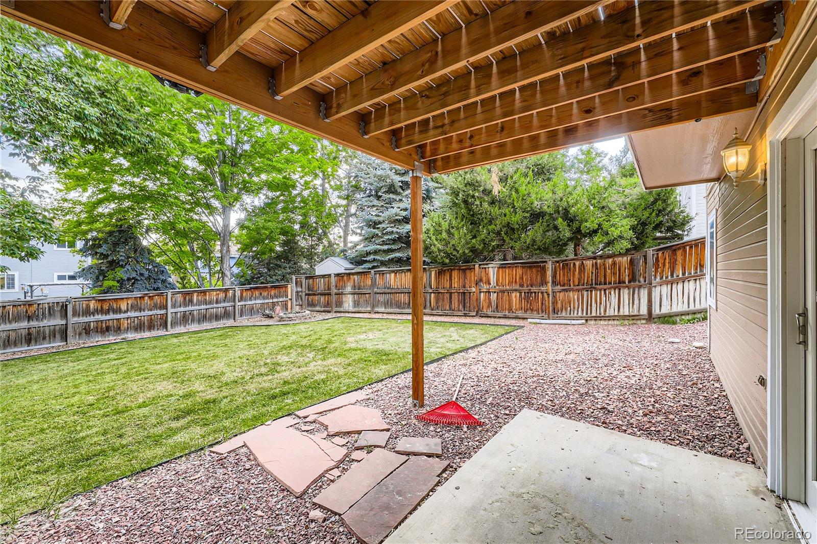 1552 Spring Water Place Highlands Ranch, CO 80129 - Photo 26 of 28 a view of a backyard with fence