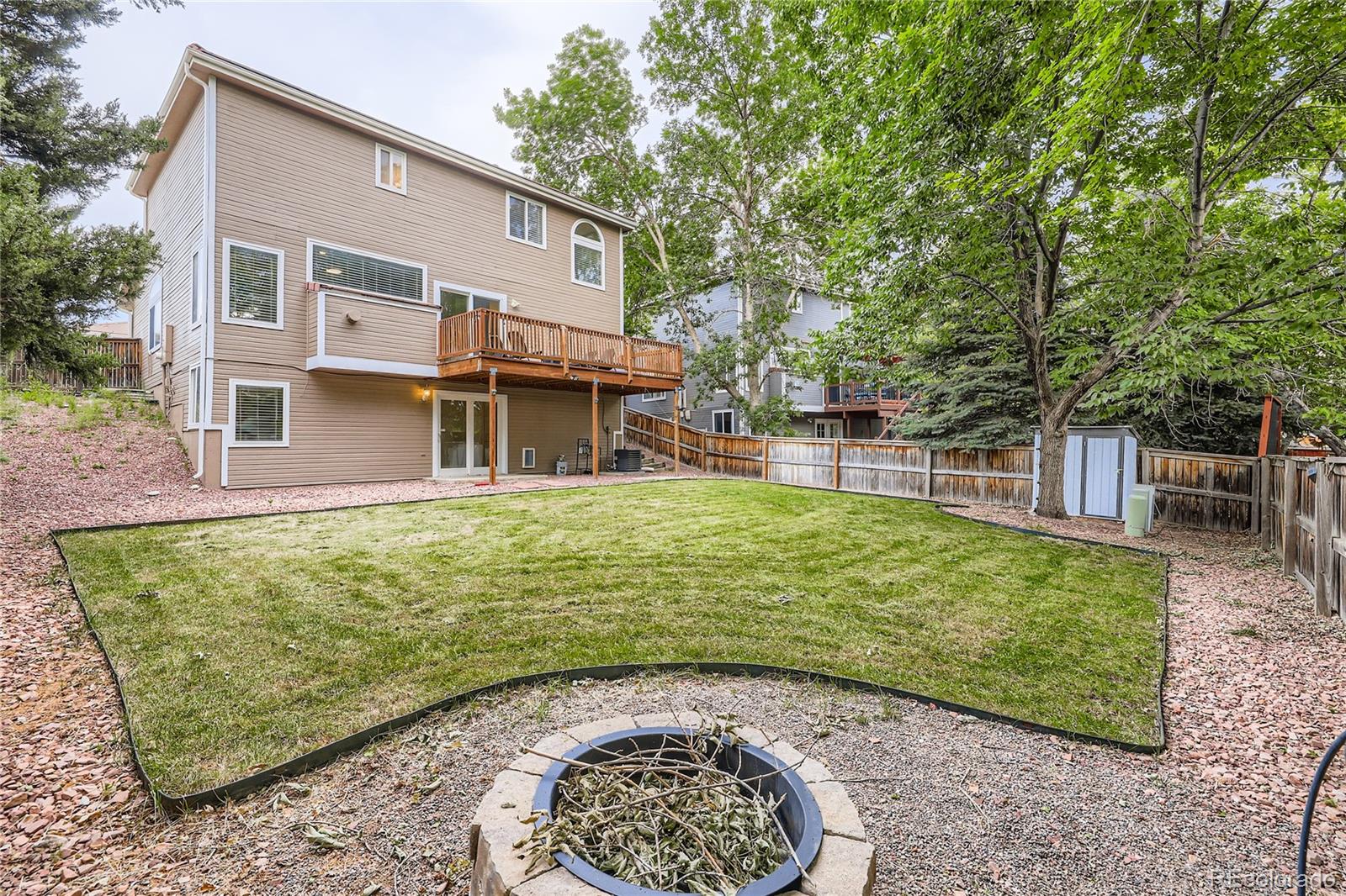 1552 Spring Water Place Highlands Ranch, CO 80129 - Photo 27 of 28 a view of a house with a backyard