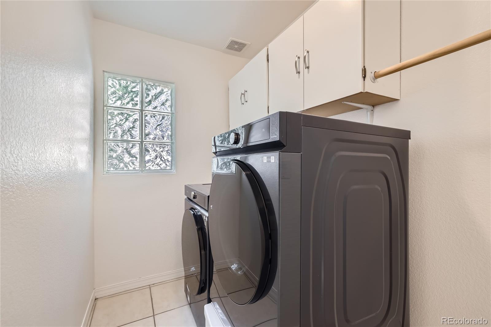1552 Spring Water Place Highlands Ranch, CO 80129 - Photo 10 of 28 a utility room with dryer and washer