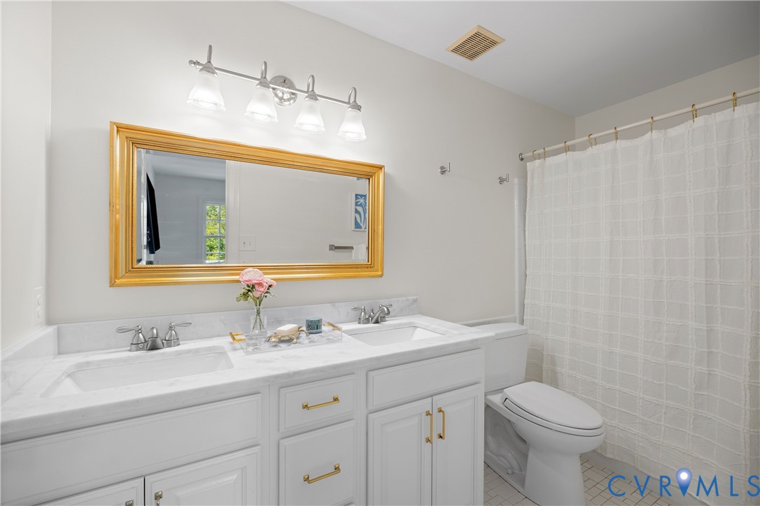 300 North Ridge Road, Unit 97 Henrico, VA 23229 - Photo 27 of 35 Double vanity with marble counter, tub/shower