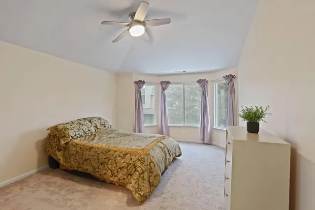 a spacious bathroom with a tub shower and sink