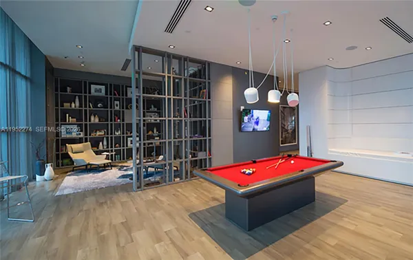 a room with gym equipment and a table