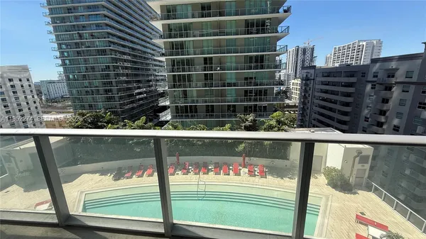 a view of swimming pool from a balcony