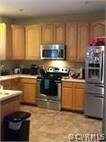 20025 Ivan Road Petersburg, VA 23803 - Photo 4 of 5 a kitchen with a sink stove top oven and cabinets