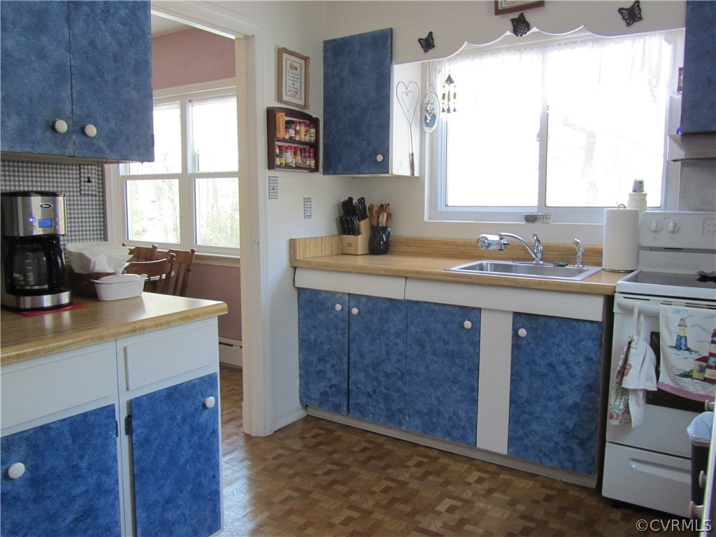 11432 Hanover Courthouse Road Hanover, VA 23069 - Photo 17 of 22 a kitchen with a sink stove and cabinets