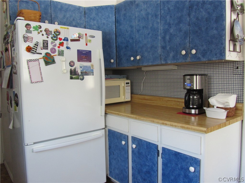 11432 Hanover Courthouse Road Hanover, VA 23069 - Photo 18 of 22 a white refrigerator freezer sitting inside of a kitchen