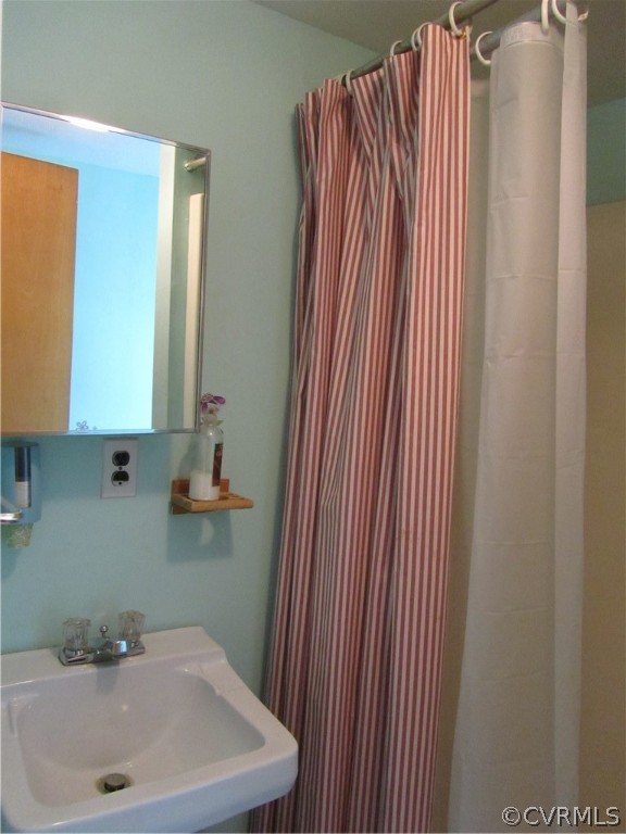 11432 Hanover Courthouse Road Hanover, VA 23069 - Photo 19 of 22 a bathroom with a sink and a mirror