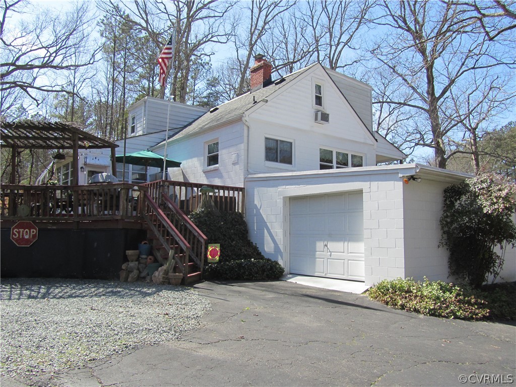 11432 Hanover Courthouse Road Hanover, VA 23069 - Photo 6 of 22 a view of a white house with a yard and a large tree