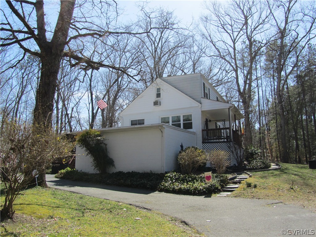 11432 Hanover Courthouse Road Hanover, VA 23069 - Photo 9 of 22 a view of a white house with a yard and large trees