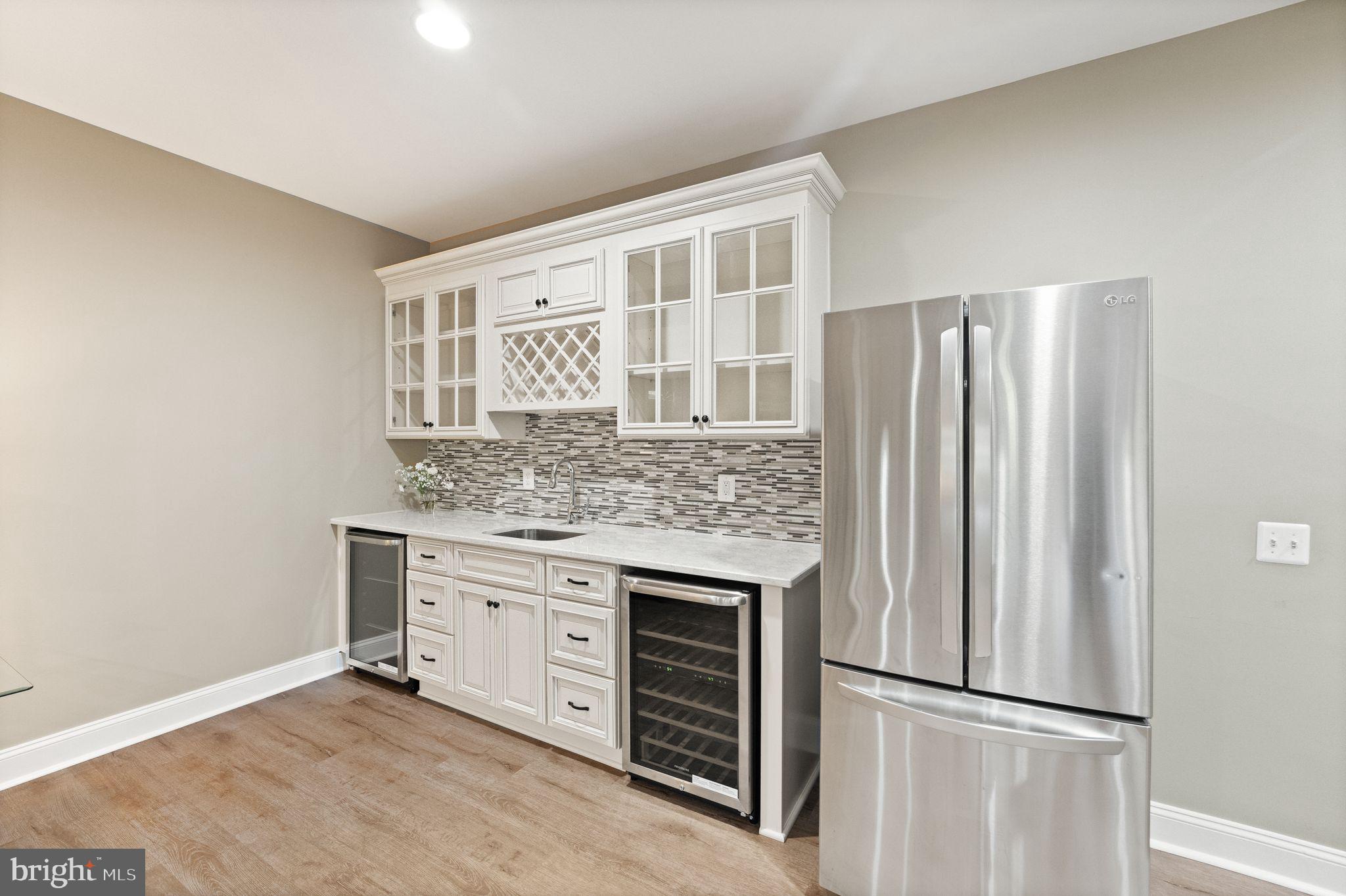 27712 Paddock Trail Place Chantilly, VA 20152 - Photo 77 of 106 Bar with beer/soda and wne fridges