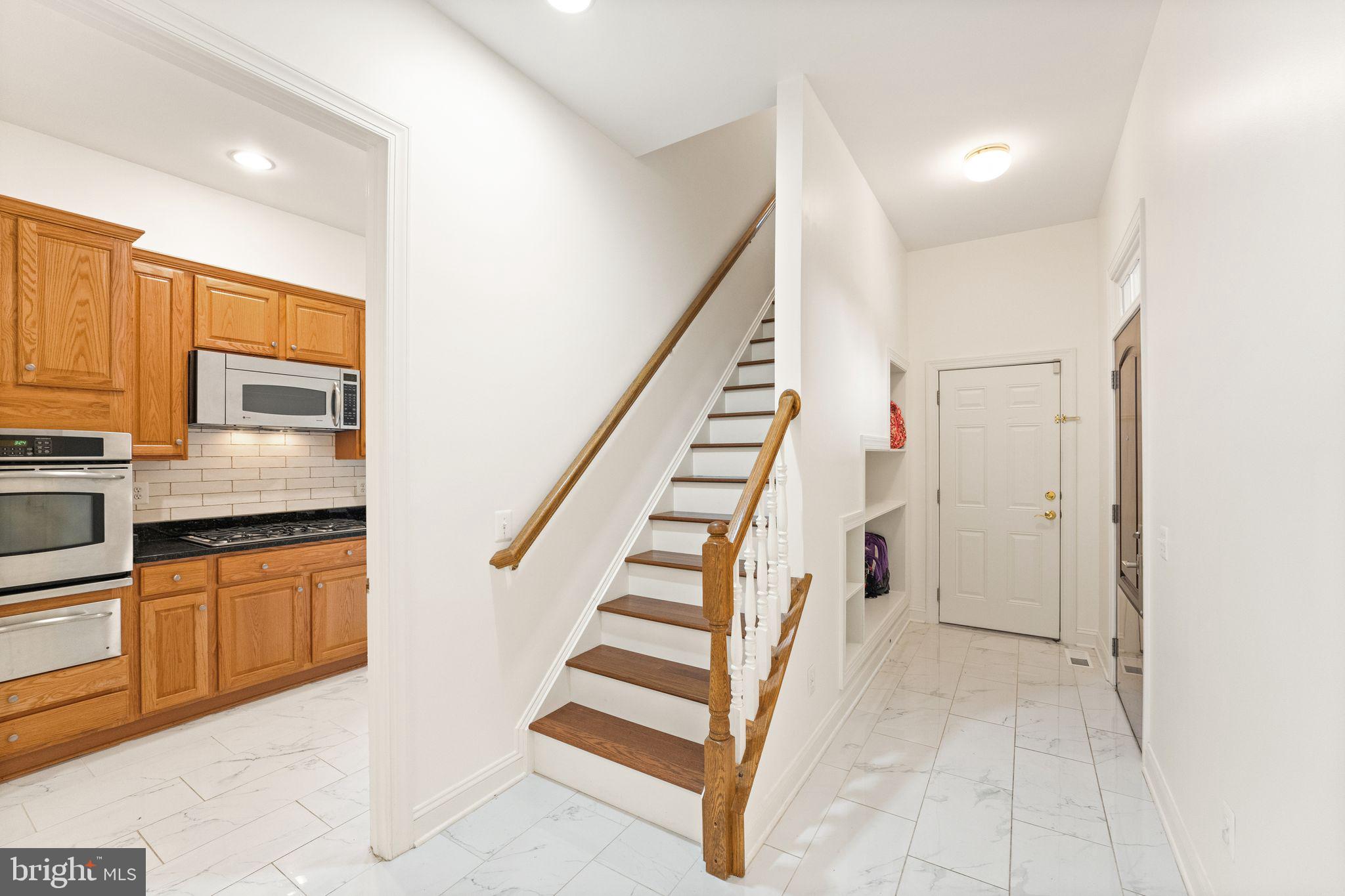 27712 Paddock Trail Place Chantilly, VA 20152 - Photo 89 of 106 Prep kitchen and stairs to aupair suite