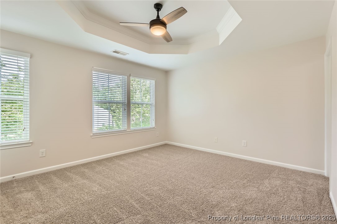 408 Panorama View Loop Cary, NC 27519 - Photo 13 of 28 an empty room with windows and fan
