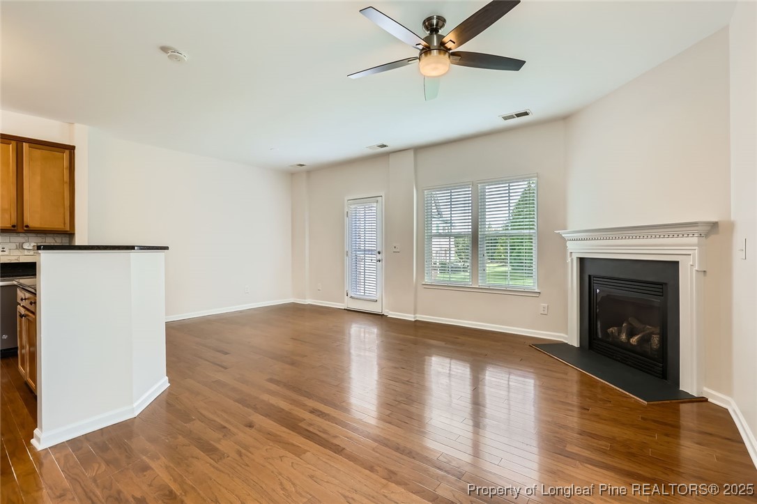 408 Panorama View Loop Cary, NC 27519 - Photo 5 of 28 a view of empty room with wooden floor and fan