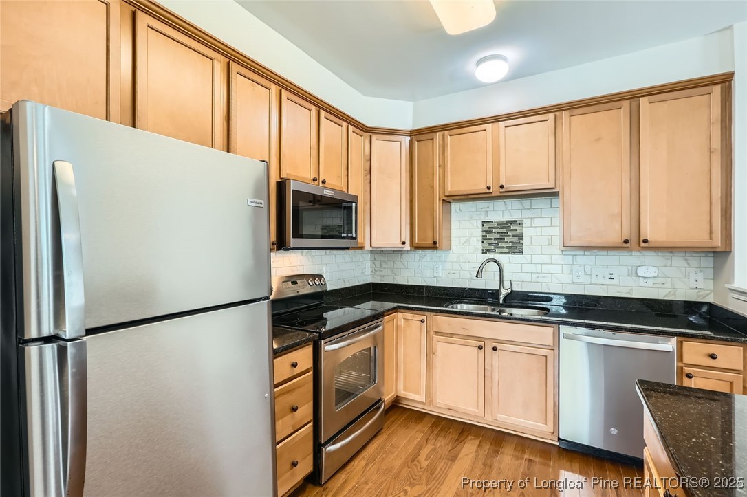 408 Panorama View Loop Cary, NC 27519 - Photo 8 of 28 a kitchen with granite countertop white cabinets and white appliances