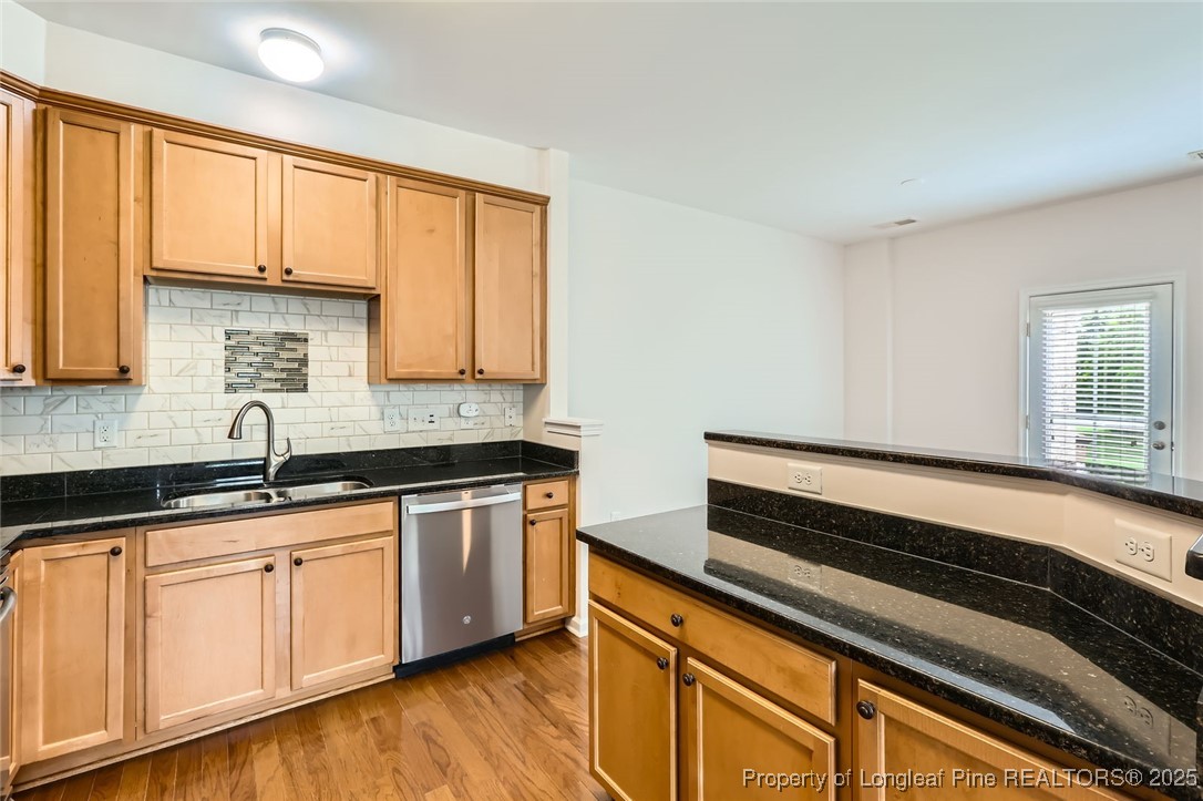 408 Panorama View Loop Cary, NC 27519 - Photo 9 of 28 a kitchen with granite countertop a sink cabinets and wooden floor
