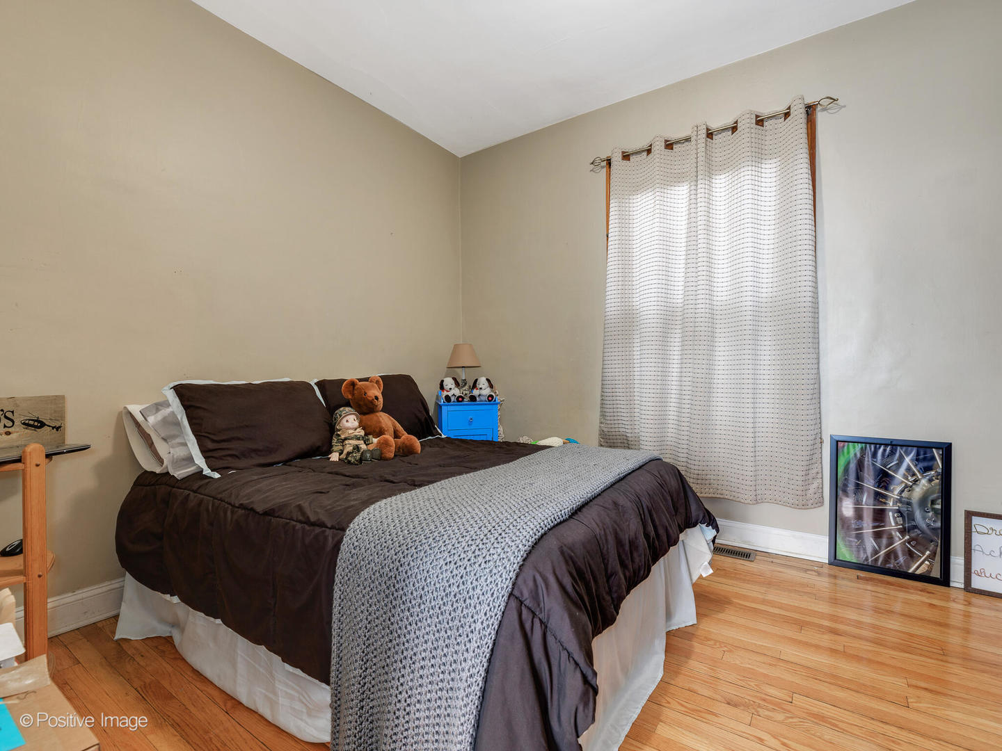 Undisclosed Address Chicago, IL 60630 - Photo 4 of 5 a bed sitting in a bedroom next to a window