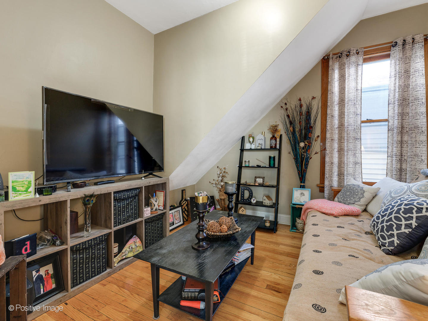 Undisclosed Address Chicago, IL 60630 - Photo 5 of 5 a living room with furniture and a flat screen tv