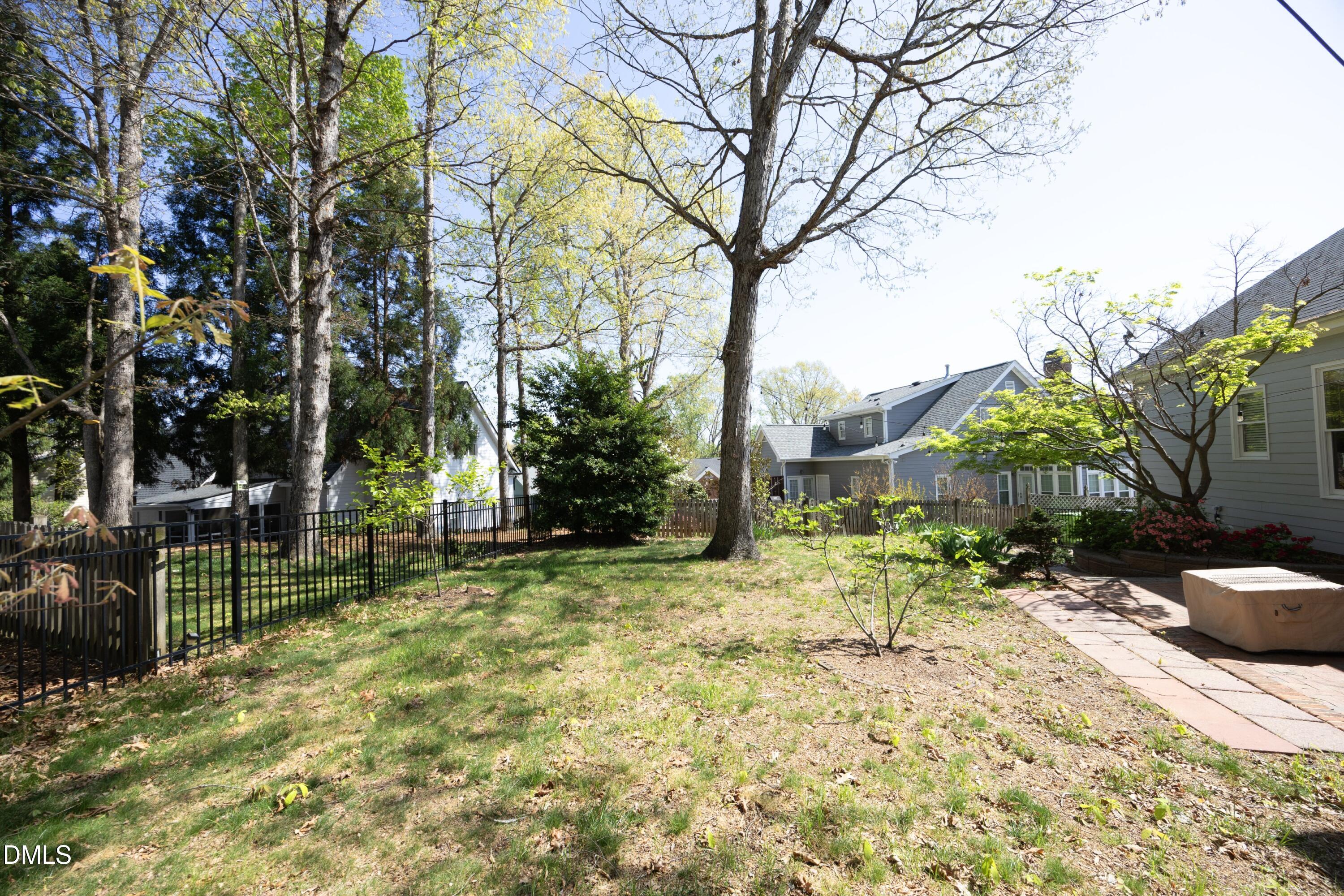 1427 Moosecreek Drive Raleigh, NC 27614 - Photo 42 of 51 a backyard of a house with table and chairs