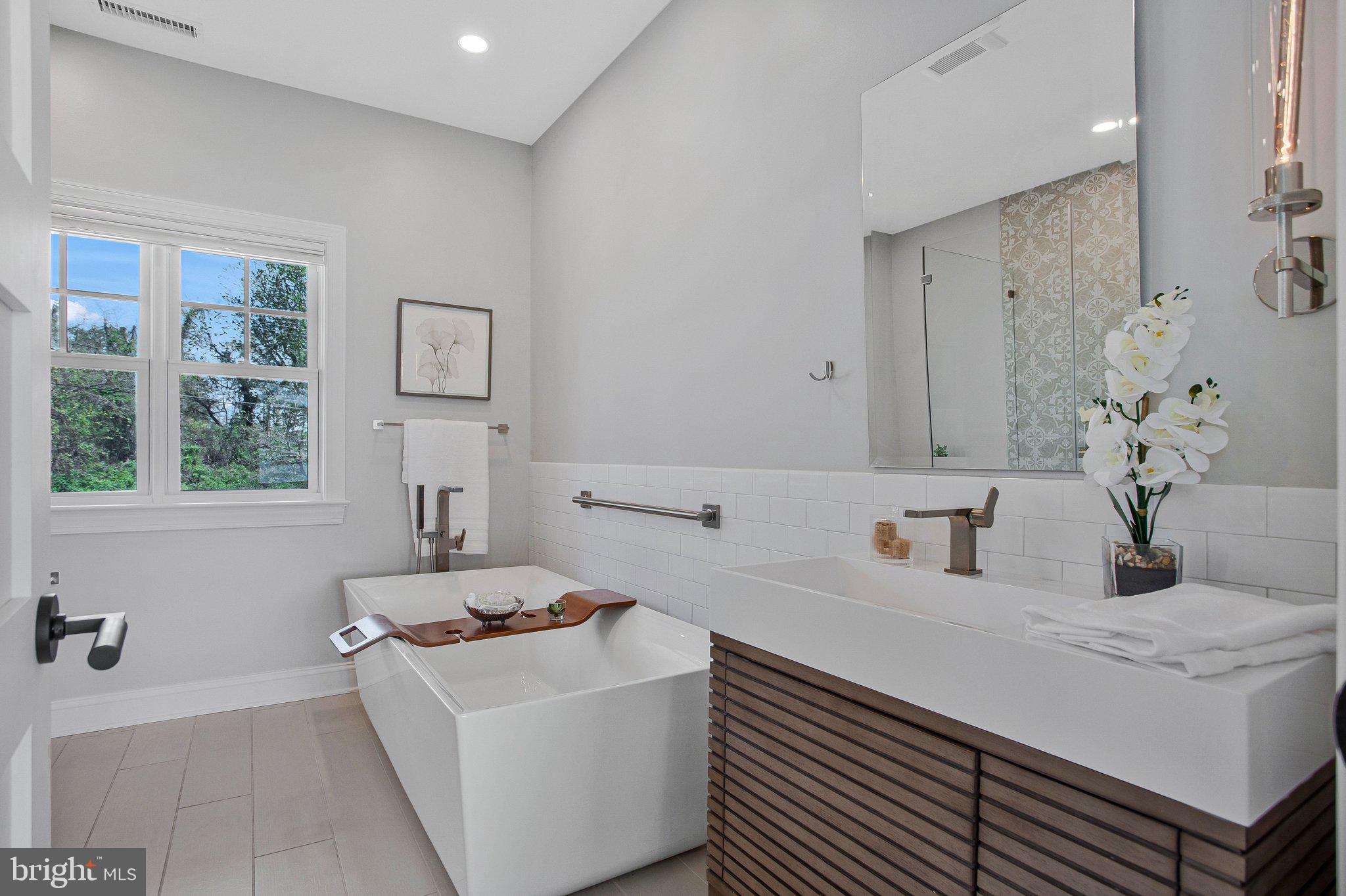 6146 Drum Point Road Deale, MD 20751 - Photo 23 of 75 a bathroom with a sink and a bathtub