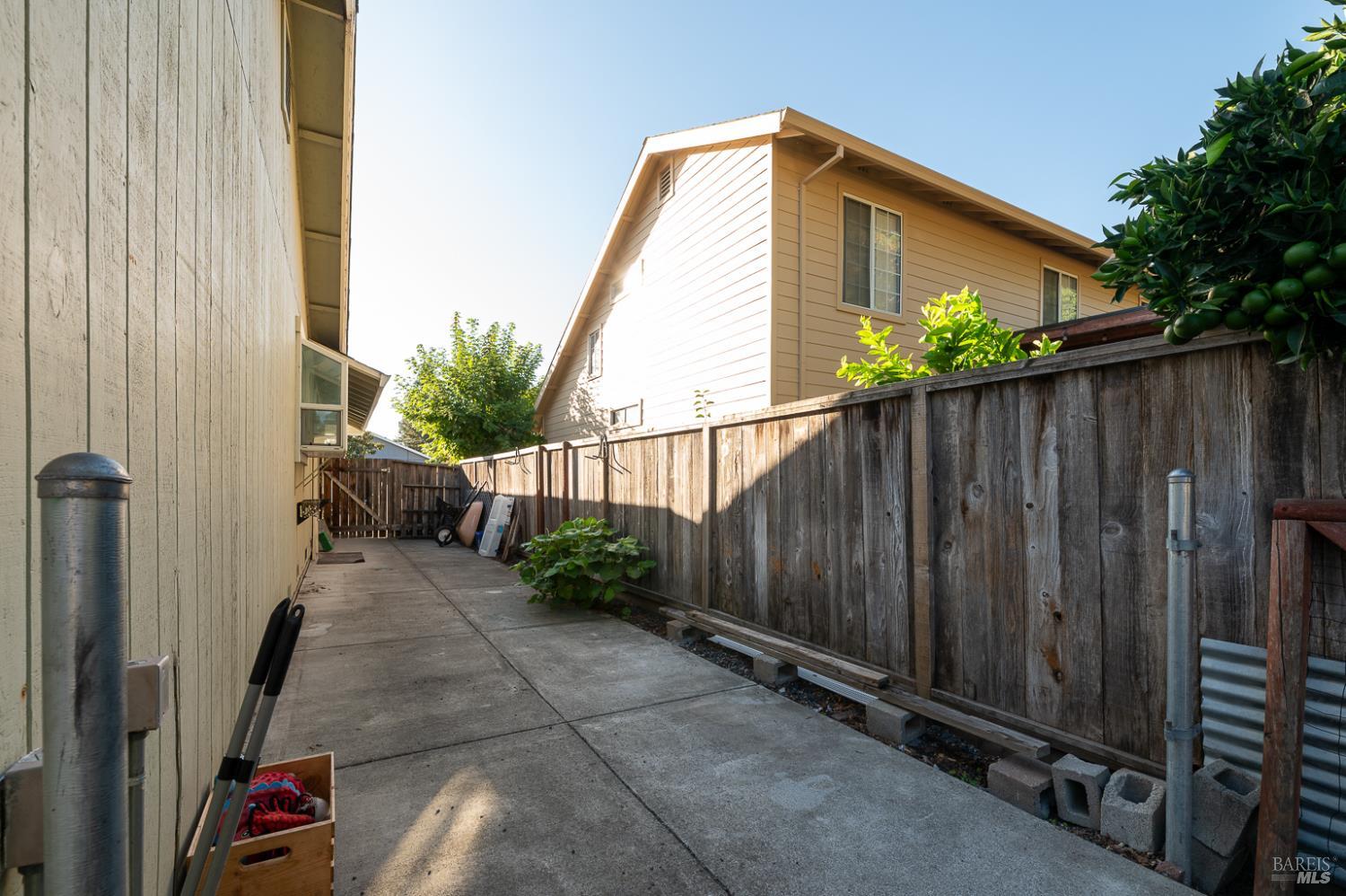 978 Eleanor Avenue Rohnert Park, CA 94928 - Photo 28 of 36 a backyard with potted plants and wooden fence
