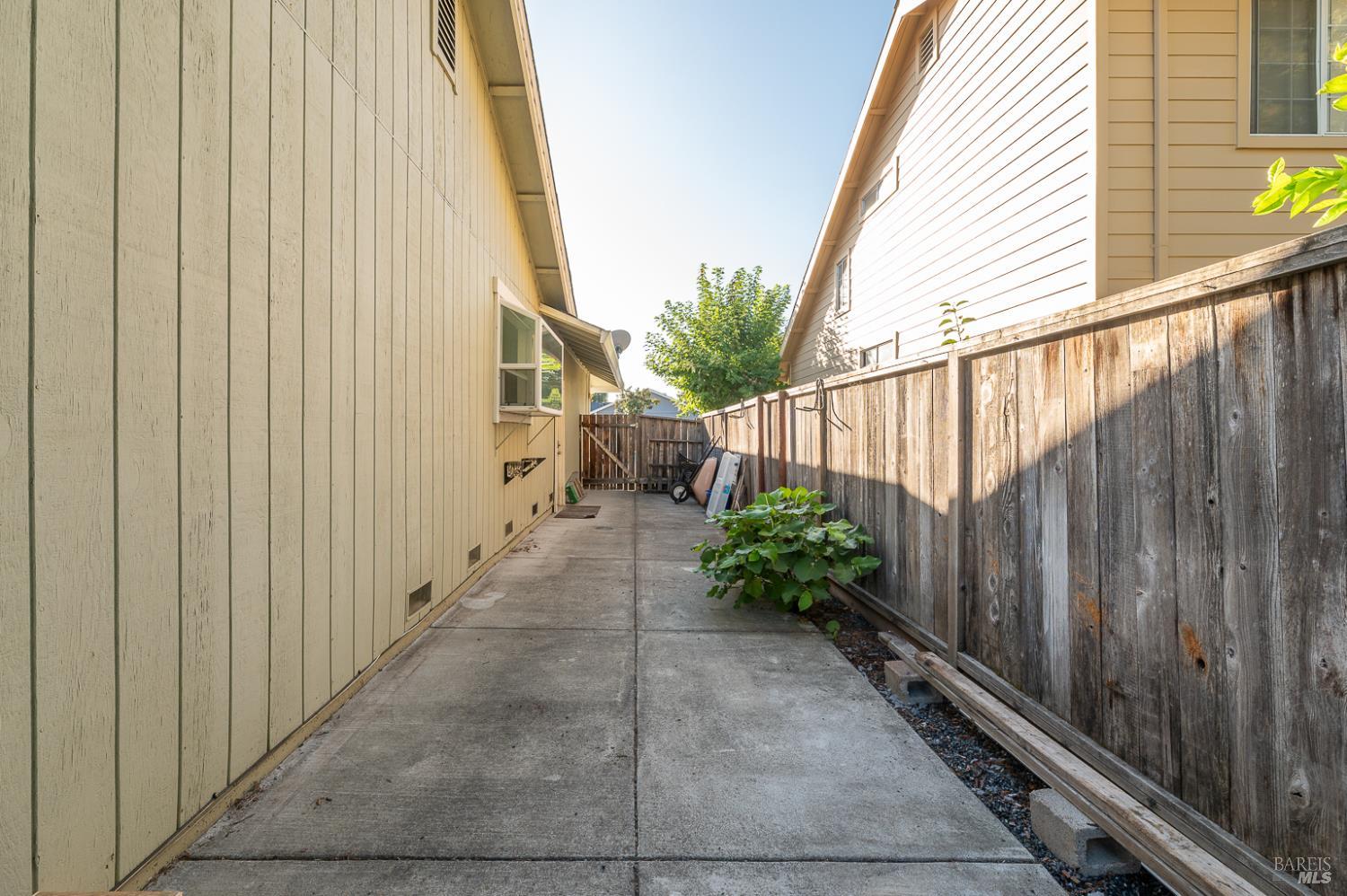 978 Eleanor Avenue Rohnert Park, CA 94928 - Photo 30 of 36 a view of a pathway gate with wooden fence
