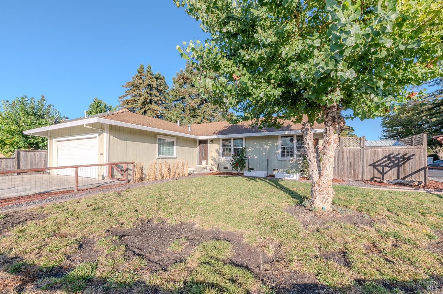 978 Eleanor Avenue Rohnert Park, CA 94928 - Photo 4 of 36 a front view of house with yard and trees in the background