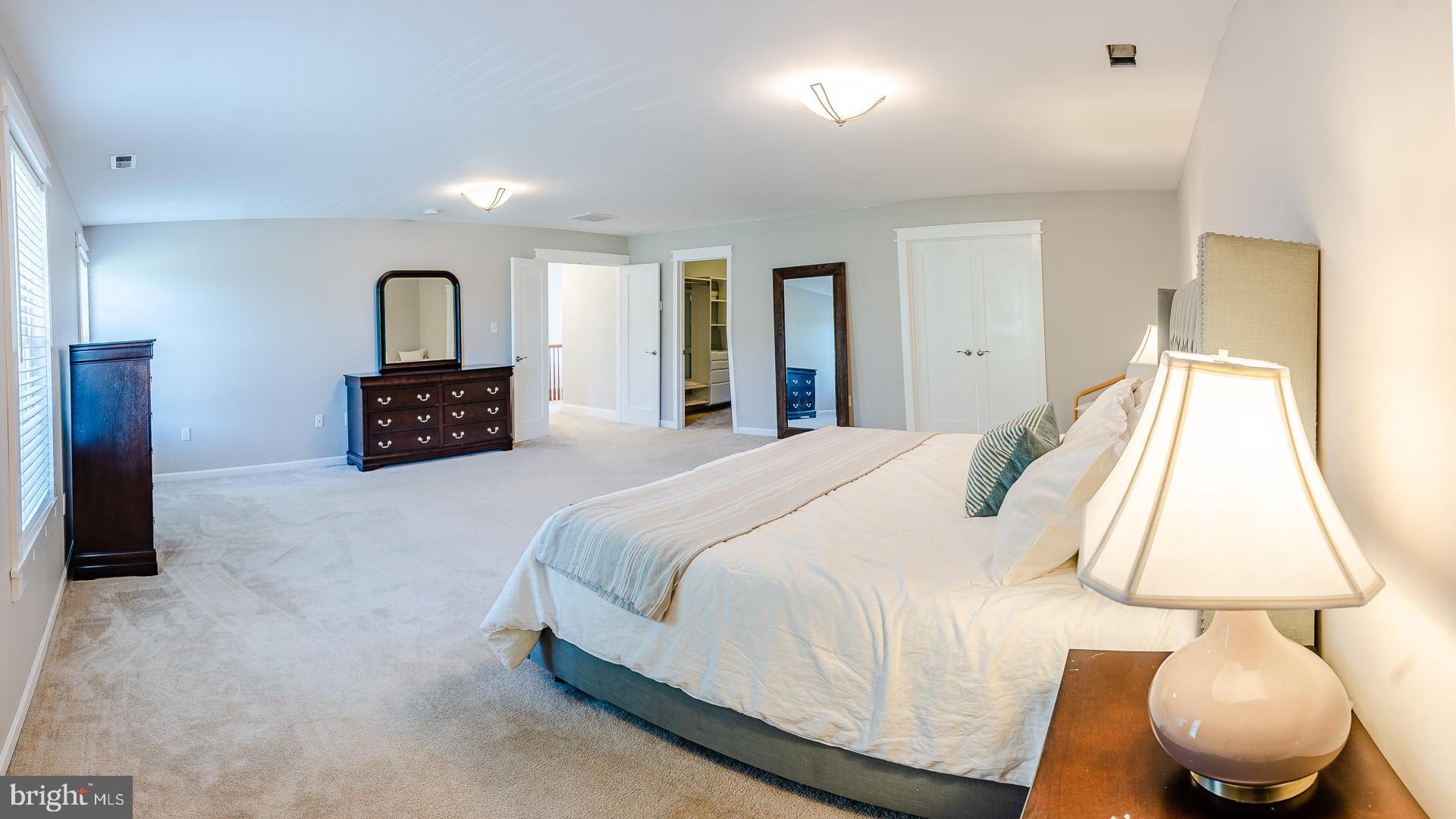 6825 Briscoe Turn Road Owings, MD 20736 - Photo 30 of 47 a bedroom with a bed and a chair