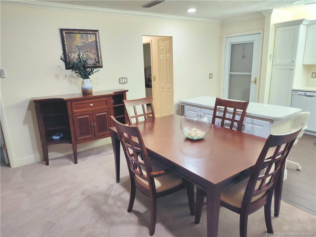 Undisclosed Address Stuart, FL 34997 - Photo 11 of 64 a view of a dining room with tables and chairs