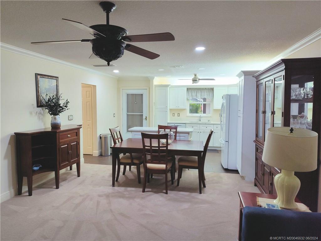 Undisclosed Address Stuart, FL 34997 - Photo 13 of 64 a view of a dining room with furniture