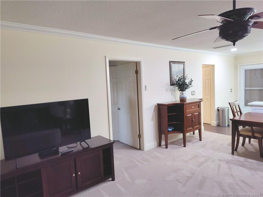 Undisclosed Address Stuart, FL 34997 - Photo 15 of 64 a living room with furniture and a flat screen tv