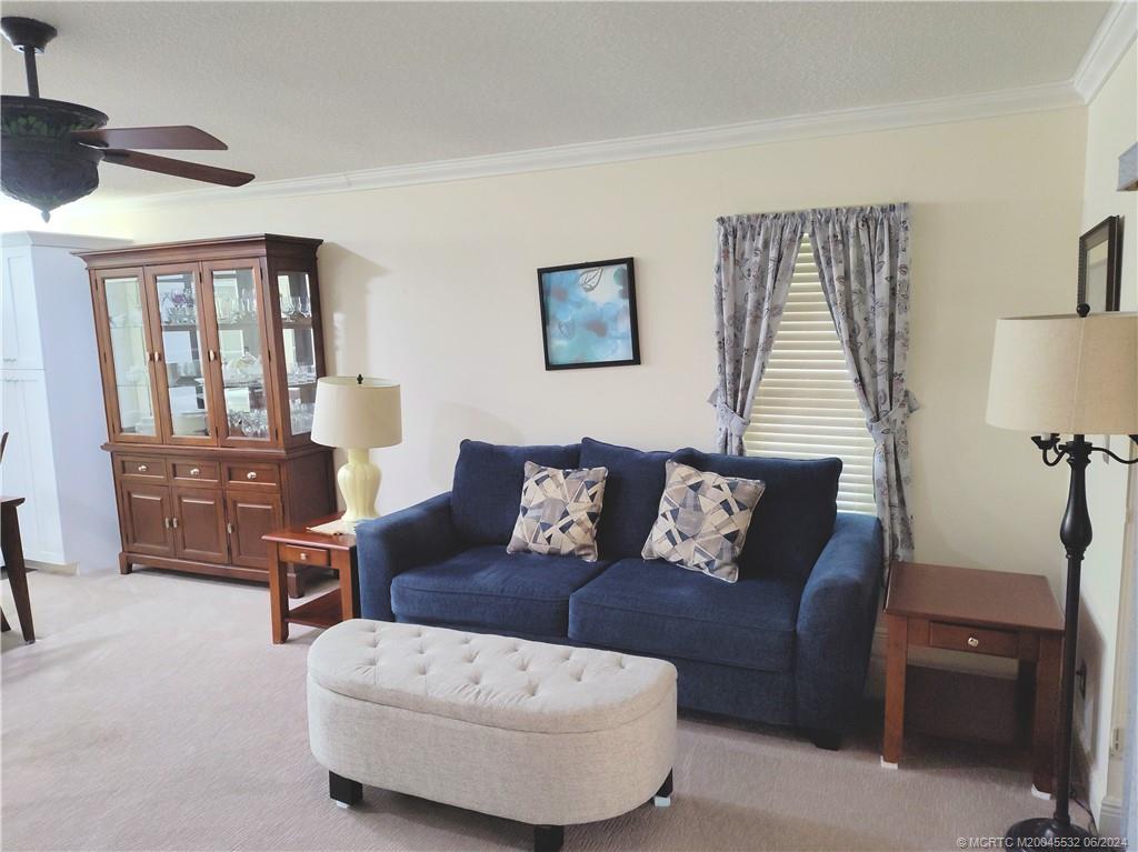 Undisclosed Address Stuart, FL 34997 - Photo 18 of 64 a living room with furniture and a window